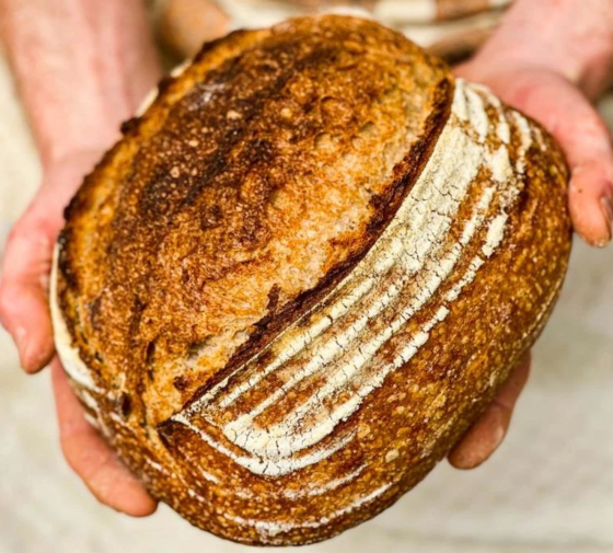 Sourdough from Pike Deli in Clonakilty being held in bakers hands
