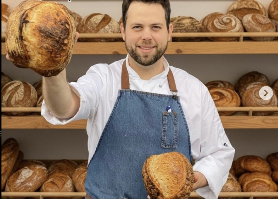 Vitor, owner of Vitors Bread Bar in Kildare, holding a loaf of sourdough