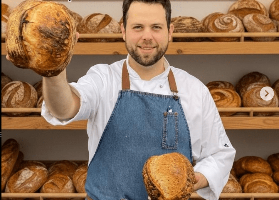 Vitor, owner of Vitors Bread Bar in Kildare, holding a loaf of sourdough